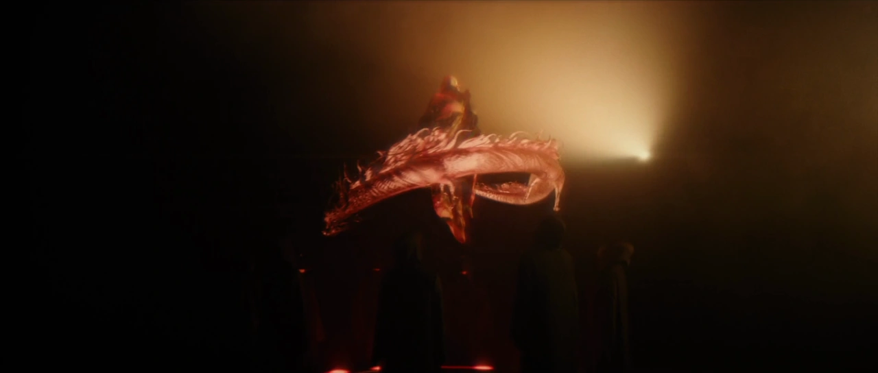 Red energy coils around Jasmine Sokko during the ritual.