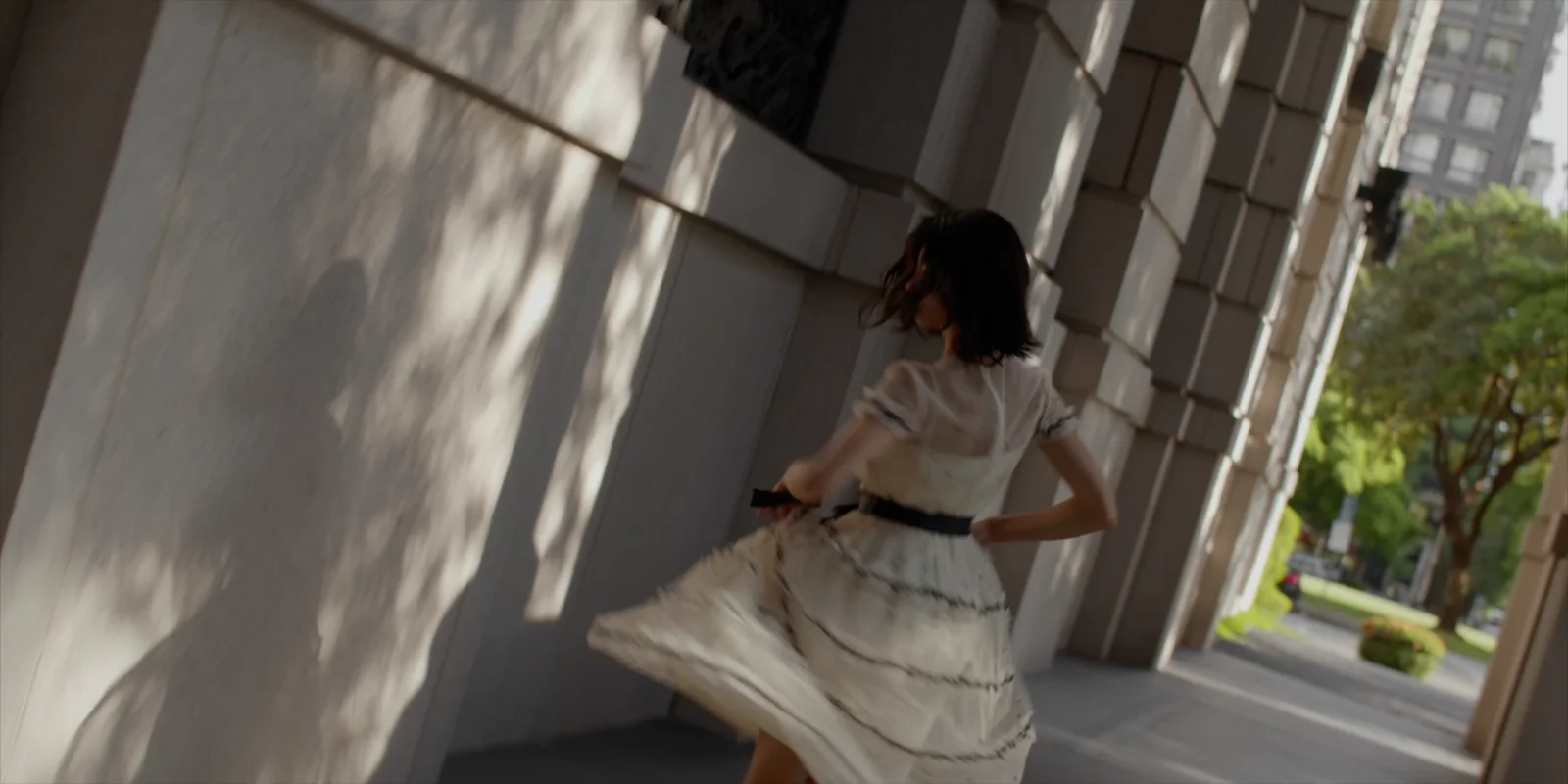 Lian Ju Construction — Movement beside the stone facade
