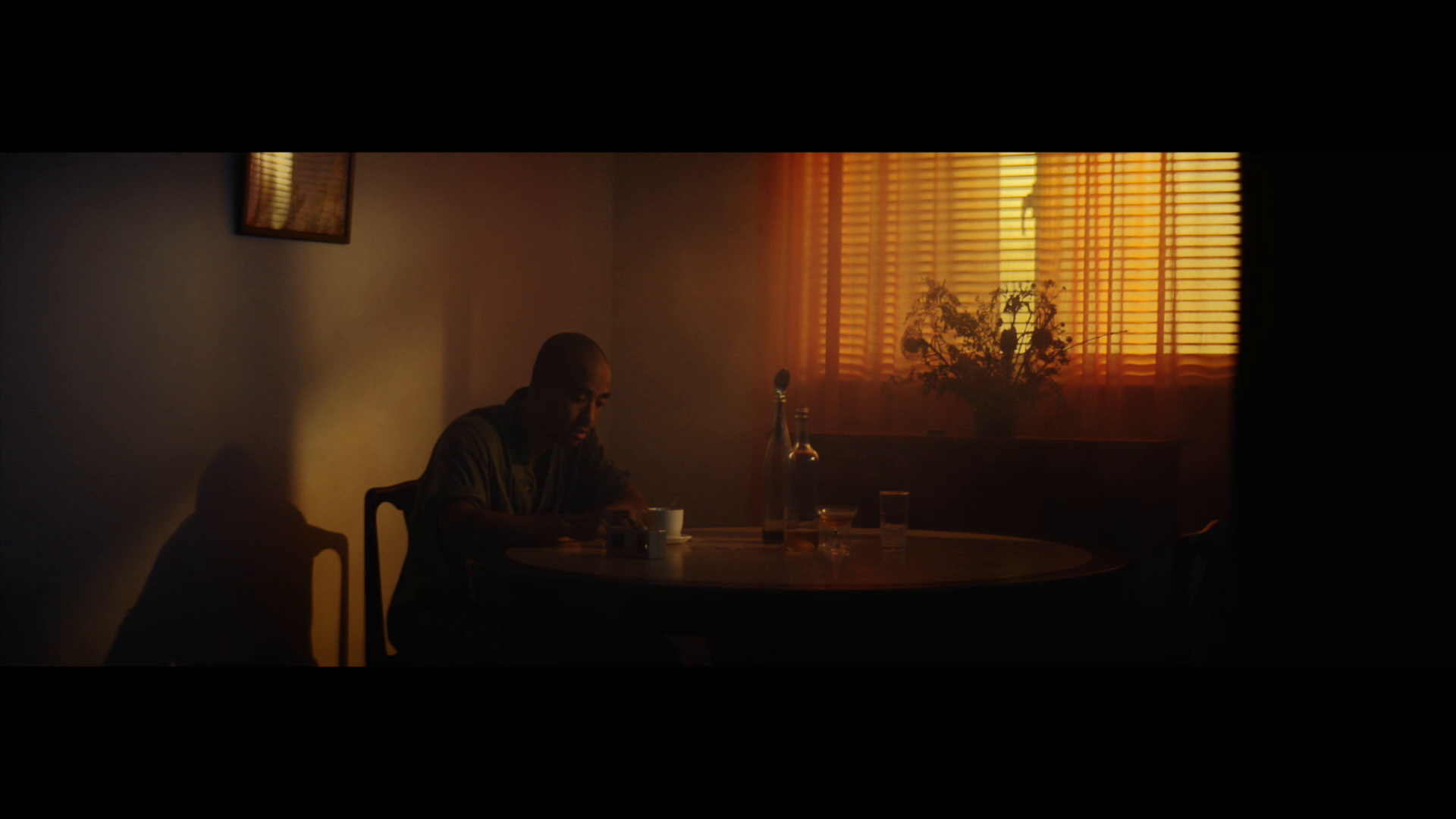 A solitary figure in amber light