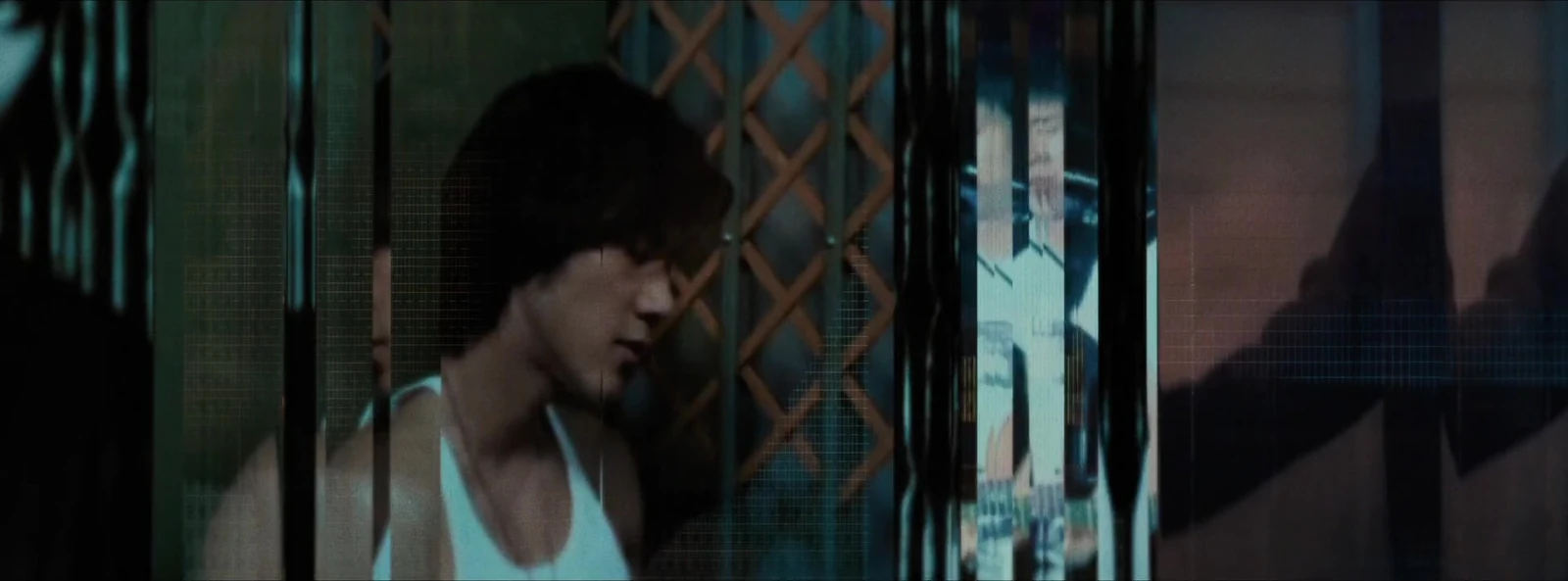 A scene of a figure at a doorway fills a screen within the digital environment.